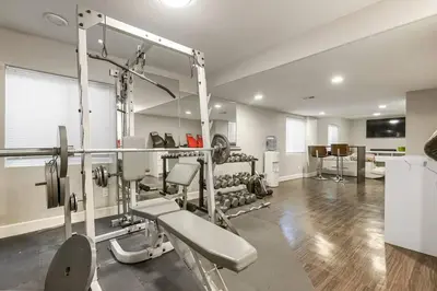 a room with a gym with a bunch of equipment at Sleeps 12 - Thornton - 25 Min to Downtown Denver in Thornton