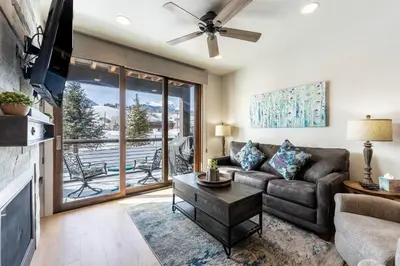 a living room with a couch and a tv at Blue R Flats Bld 1 103 in Silverthorne