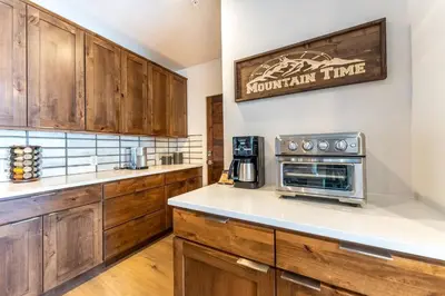 a kitchen with wooden cabinets and a counter top at Blue R Flats Bld 1 103 in Silverthorne