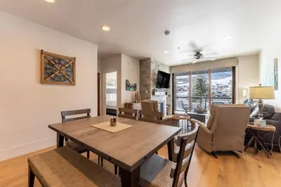 a dining room and living room with a table and chairs at Blue R Flats Bld 1 103 in Silverthorne
