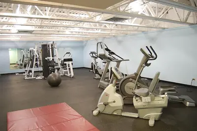 a gym with several treadmills and exercise machines at Snowblaze E102 Studio in Winter Park