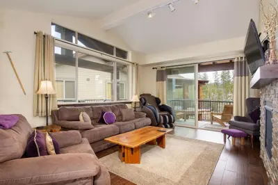 a living room with a couch and a table at Trailhead Lodges Building 101 Unit 131 in Winter Park