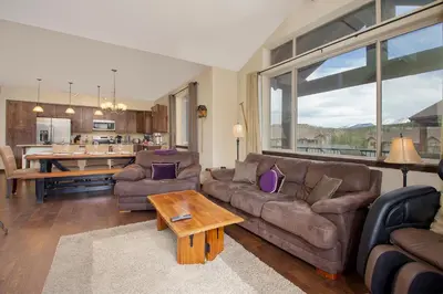 a living room with a couch and a table at Trailhead Lodges Building 101 Unit 131 in Winter Park