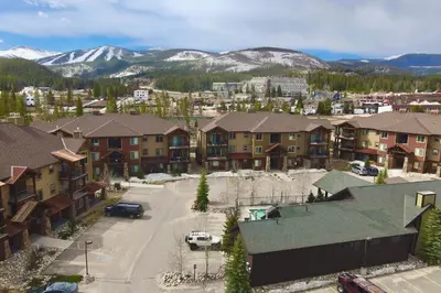 an aerial view of a resort town with mountains at Trailhead Lodges Building 101 Unit 131 in Winter Park