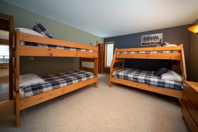 a bedroom with two bunk beds in a house at Iron Horse Building J Unit 1309 in Winter Park