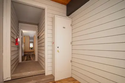a hallway of a house with a white wall at Iron Horse Building J Unit 1309 in Winter Park