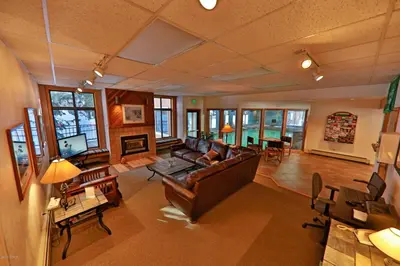 a living room with a couch and a table at Beaver Village Unit #0333 in Winter Park