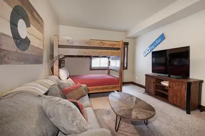 a living room with a couch and a bunk bed at 751 Mountain Terrace in Fraser