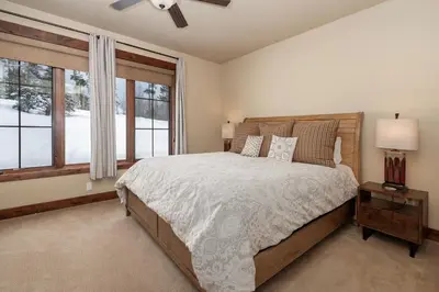 a bedroom with a large bed and a window at 751 Mountain Terrace in Fraser