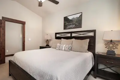 a bedroom with a large bed with white sheets at 751 Mountain Terrace in Fraser
