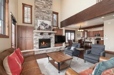 a living room with a couch and a fireplace at 751 Mountain Terrace in Fraser