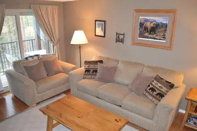a living room with a couch and a table at Beaver Village Unit #0521R in Winter Park