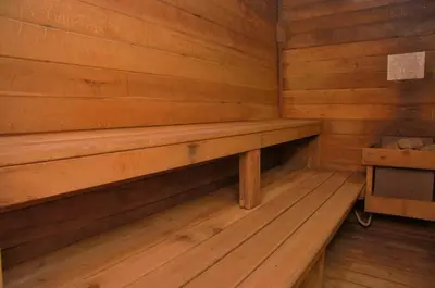 an empty wooden bench in a wooden cabin at Beaver Village Unit #0521 in Winter Park