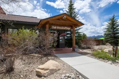 a building with a sign that reads city membership at Meadow Ridge Court 9 Unit 4 in Fraser