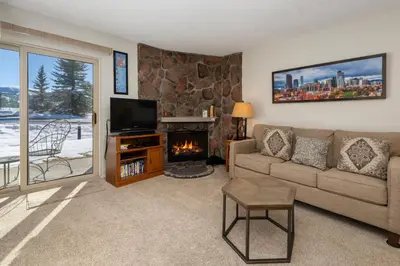 a living room with a couch and a fireplace at Meadow Ridge Court 9 Unit 4 in Fraser