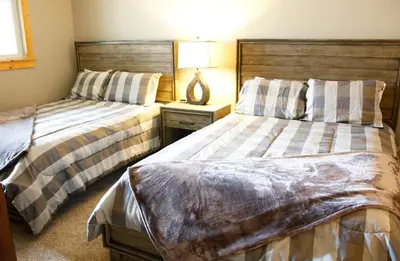 two beds sitting next to each other in a bedroom at Meadow Ridge Court 8 Unit 6 in Fraser