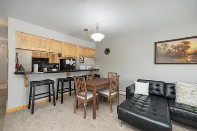 a living room with a couch and a table at Meadow Ridge Court 8 Unit 6 in Fraser