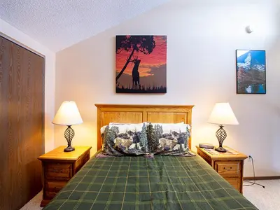 a bedroom with a bed with two night stands and two lamps at Meadow Ridge Court 28 Unit 6 in Fraser