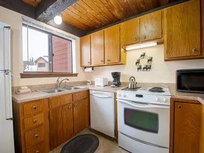a kitchen with a white stove and a sink at Meadow Ridge Court 28 Unit 6 in Fraser