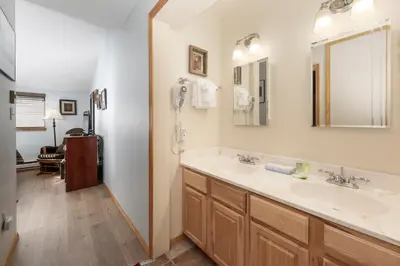 a bathroom with a double sink and a shower at Beaver Village Unit #0232R in Winter Park