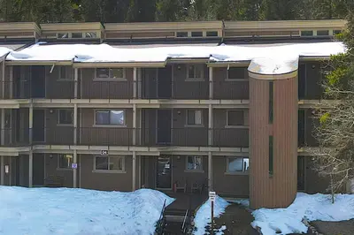 a building with snow on top of it at Beaver Village Unit #0412 in Winter Park