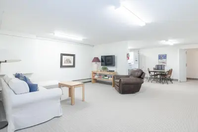a living room with a couch and chairs and a table at Beaver Village Unit #0412 in Winter Park
