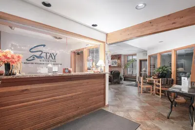 a restaurant with a counter and a dining room at Beaver Village Unit #0412 in Winter Park