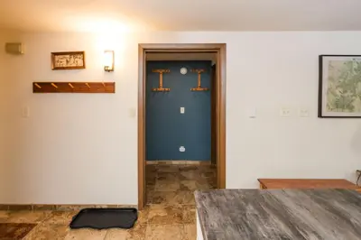 a room with a blue door with the letter t on it at Beaver Village Unit #0612 in Winter Park