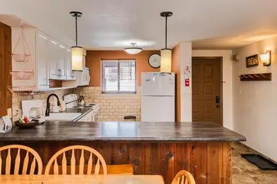 a kitchen with a wooden counter top and a refrigerator at Beaver Village Unit #0612 in Winter Park