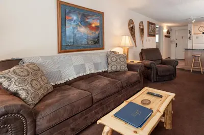 a living room with a couch and a coffee table at Beaver Village Unit #0621 in Winter Park