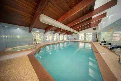 a large indoor swimming pool in a house at Beaver Village Unit #0623R in Winter Park