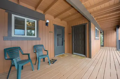 two chairs sitting on the porch of a house at Beaver Village Unit #0623 in Winter Park