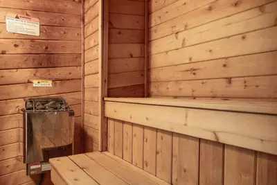 a sauna with a bench in a wooden cabin at Beaver Village Unit #0711 in Winter Park