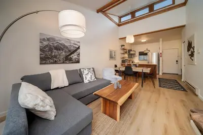 a living room with a couch and a table at Beaver Village Unit #0332 in Winter Park