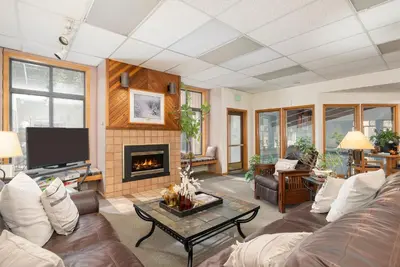 a living room with a couch and a fireplace at Beaver Village Unit #0514 in Winter Park