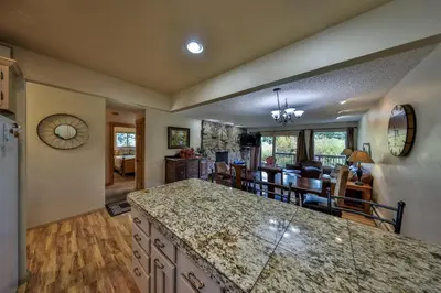 a kitchen and living room with a large counter top at Hi Country Haus Unit 1801 in Winter Park