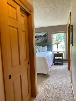a bedroom with a bed and a window at Hi Country Haus Unit 1805 in Winter Park