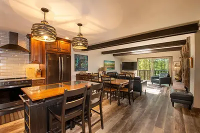 a kitchen and dining room with a table and chairs at Hi Country Haus Unit 2121 in Winter Park