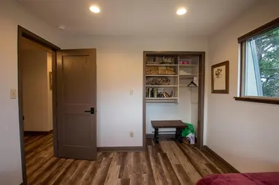 a room with a door and a table and a window at Hi Country Haus Unit 2121 in Winter Park