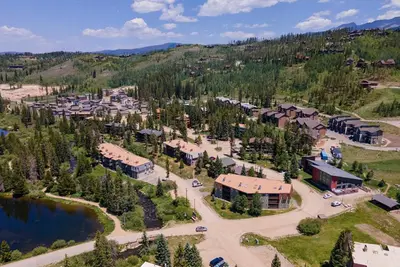 an aerial view of a resort with a lake at Hi Country Haus Unit 2121 in Winter Park