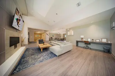 a living room with a white couch and a table at Hi Country Haus Unit 2506 in Winter Park