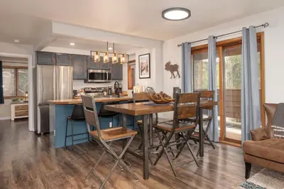 a kitchen and dining room with a table and chairs at Hi Country Haus Unit 2506 in Winter Park