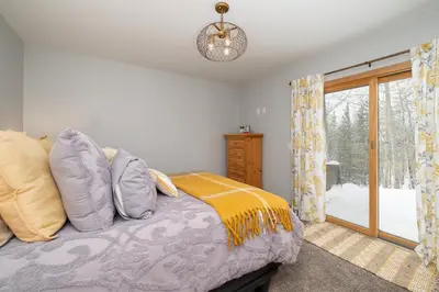 a bedroom with a bed and a window at Silverado I Building A Unit 101 in Winter Park