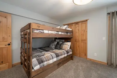 a bedroom with a bunk bed in a house at Silverado I Building A Unit 101 in Winter Park