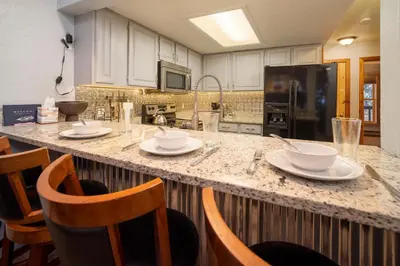 a kitchen with a counter with dishes on it at Creekside Unit 403 in Winter Park