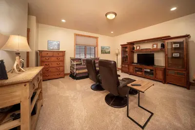 a living room with two chairs and a television at 500 North Lupine in Fraser