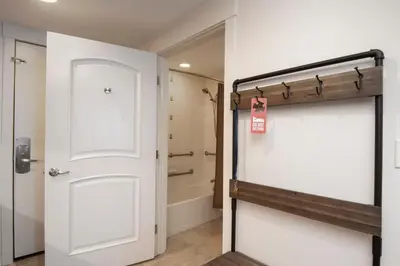 a bathroom with a white door and a shower at Fraser Crossing 3518 Studio in Winter Park