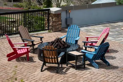 a group of chairs around a table with a fire pit at Fraser Crossing 3518 Studio in Winter Park