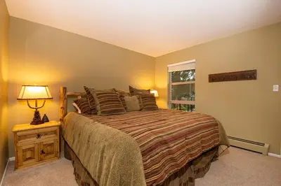 a bedroom with a large bed and a window at Hi Country Haus Unit 1903 in Winter Park
