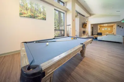 a pool table in a living room with at Hi Country Haus Unit 1903 in Winter Park